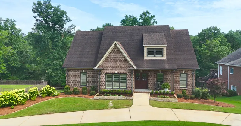 Landscape installation with planting beds at an Alabama property