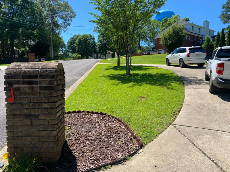 Mowed front lawn and mulched bed on a Trussville, Alabama street