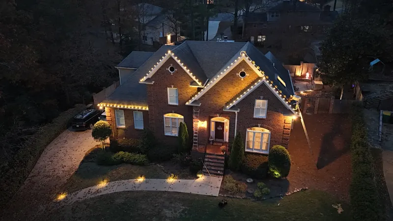 Christmas lights installed along the roofline of an Alabama home